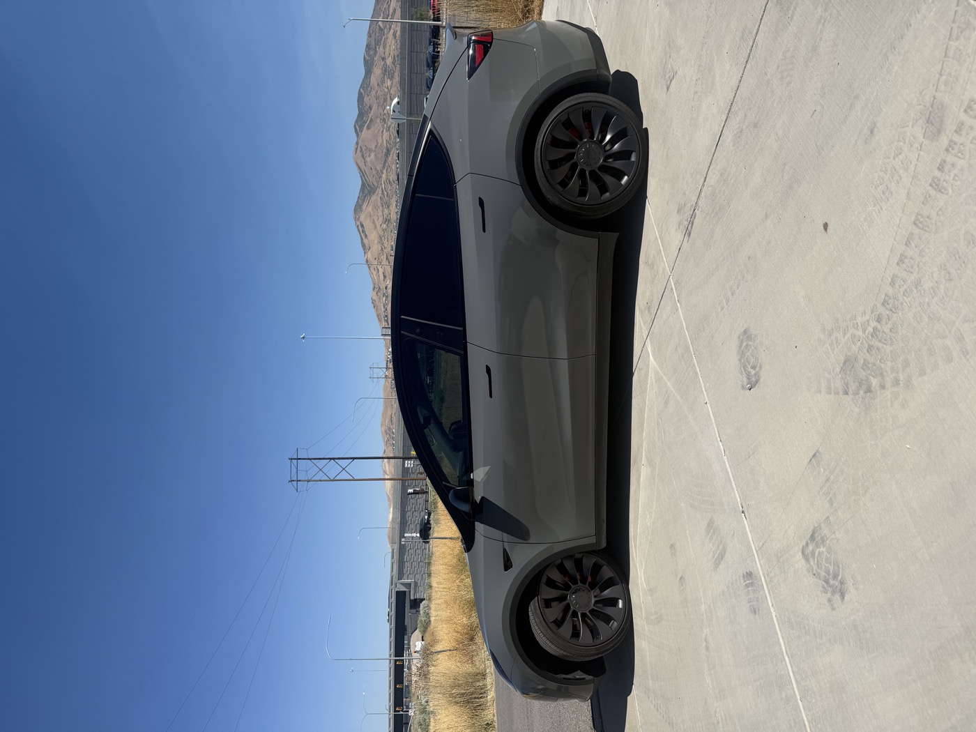 Dark gray Tesla Model Y wrap and tint — Summit Wraps Utah